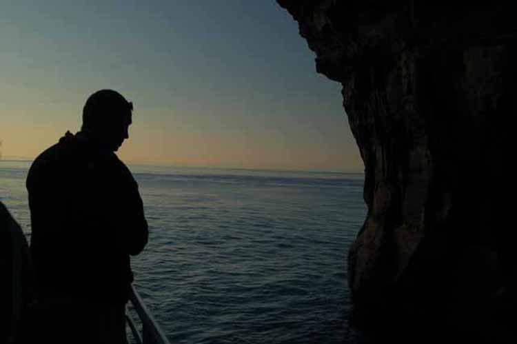 inside the cave, looking out to the water